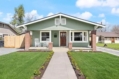 a green house with a lawn at 2 bed1 bath, historic beauty, walk downtown in Visalia