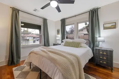 a bedroom with a bed and a window at 2 bed1 bath, historic beauty, walk downtown in Visalia