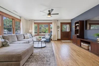 a living room with a couch and a tv at 2 bed, 2 bath, historic beauty, walk downtown in Visalia