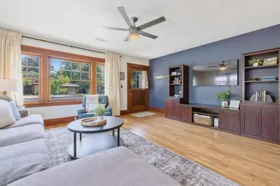 a living room with a couch and a tv at 2 bed, 2 bath, historic beauty, walk downtown in Visalia
