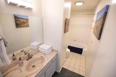 a bathroom with a sink and a toilet at Ski in Ski out King Bed Suite Hotel Room Near Village in Kirkwood
