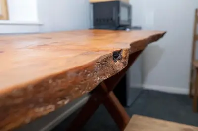 a close up of a wooden table in a room at True Ski in out Large 2 bdrm Mtn Views 4 beds in Kirkwood