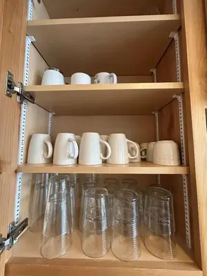 a bunch of glass mugs and cups on shelves at Kirkwood Resort between Village & Timber Creek in Markleeville