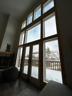 a room with a large window with snow outside at Kirkwood Resort between Village & Timber Creek in Markleeville