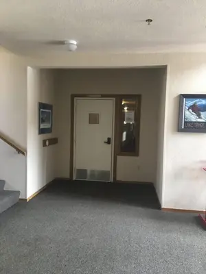 an empty room with a door and a hallway at Sun Meadows Cozy Kirkwood Ski In out Studio in Kirkwood