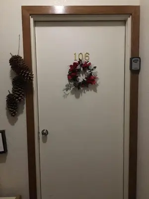a white door with a christmas wreath on it at Sun Meadows Cozy Kirkwood Ski In out Studio in Kirkwood