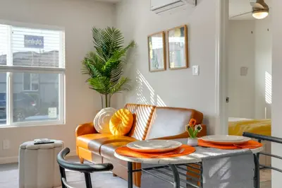 a living room with a couch and a table at Great for Digital Nomads! Convenient Manteca Apt in Manteca