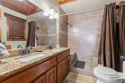 a bathroom with a sink and a shower and a toilet at Gorgeous cottage in fair oaks village in Fair Oaks