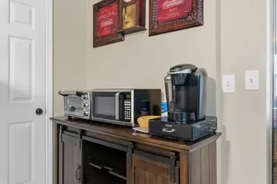 a counter with a microwave and a toaster oven at Magnificent stay at fair oaks village in Fair Oaks