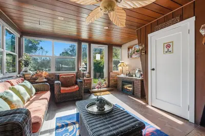 a living room with a couch and a ceiling fan at Magnificent stay at fair oaks village in Fair Oaks