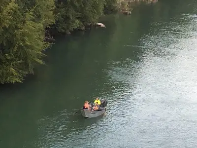 a group of people in a boat on a river at Charming vintage village house in Fair Oaks