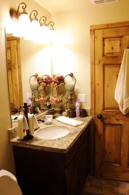 a bathroom with a sink and a mirror at Charming vintage village house in Fair Oaks