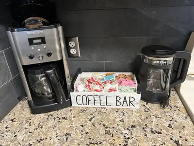 a box of coffeeaband sitting on a counter next to a coffee bar at The Meadows- Modern 1BedroomDeck and Fireplace in Kirkwood