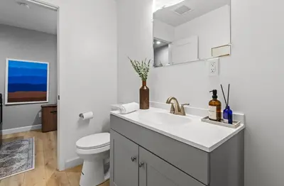 a white bathroom with a sink and a toilet at Luxury Cabin in Budget-Hot Tub -Apple Hills-Tahoe in Pollock Pines
