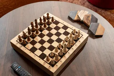 a chess board on a table next to a remote control at Dusty Sage Hollow in Fernley