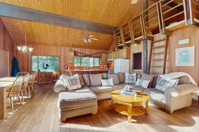 a living room with a couch and a bunk bed at Alpenglow at Dollar Point in Dollar Point