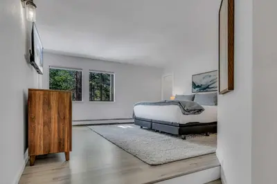 a bedroom with a bed and a television in it at Tahoe Retreat - Private Hot Tub & Scenic Views in Incline Village
