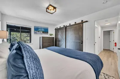a bedroom with a large bed and a window at Tahoe Retreat - Private Hot Tub & Scenic Views in Incline Village
