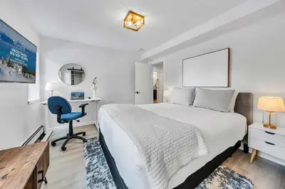 a bedroom with a bed and a desk and a chair at Tahoe Retreat - Private Hot Tub & Scenic Views in Incline Village