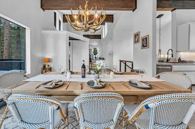 a dining room with a wooden table and chairs at Tahoe Retreat - Private Hot Tub & Scenic Views in Incline Village