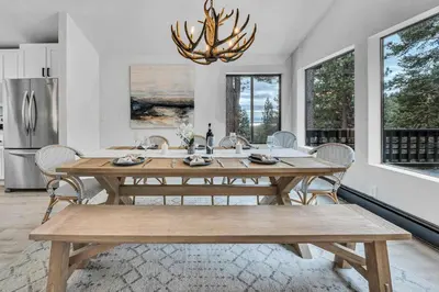 a dining room with a wooden table and chairs at Tahoe Retreat - Private Hot Tub & Scenic Views in Incline Village