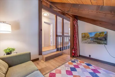 a living room with a couch and a window at Dollar Point - Observation Dr, home in Tahoe City