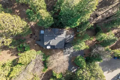 an overhead view of a house in the woods at Shaver Escape Hot Tub Cabin Retreat with AC in Shaver Lake