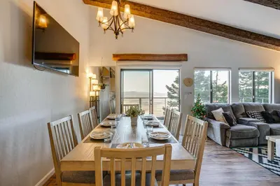 a dining room with a table and chairs and a couch at Modern Heavenly Ski Resort Mountain-Top Retreat in Stateline