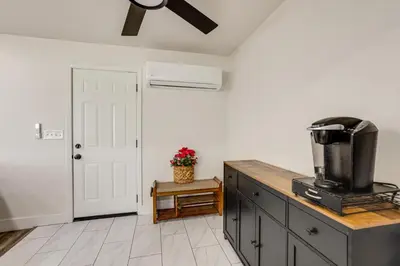 a kitchen with a counter top with a stove at Under 1 Mi to Med Center! Stylish Home in Tulare in Tulare