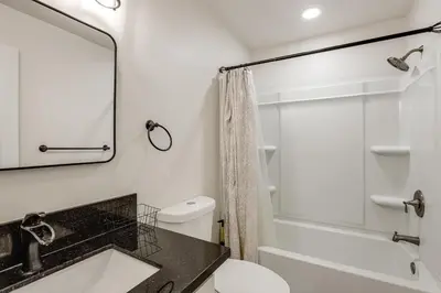 a bathroom with a sink and a toilet and a shower at Under 1 Mi to Med Center! Stylish Home in Tulare in Tulare