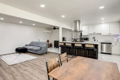 a kitchen with a table and a couch in a room at Under 1 Mi to Med Center! Stylish Home in Tulare in Tulare