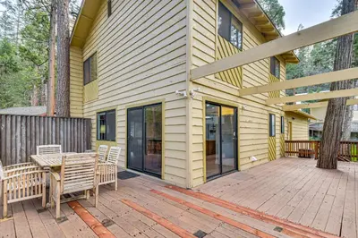 a wooden deck with a table and chairs on a house at Less Than 1 Mi to Twain Harte Lake Forest-View Retreat! in Twain Harte
