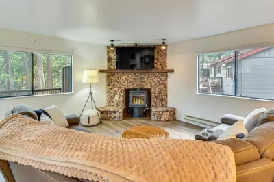 a living room with a couch and a fireplace at Less Than 1 Mi to Twain Harte Lake Forest-View Retreat! in Twain Harte