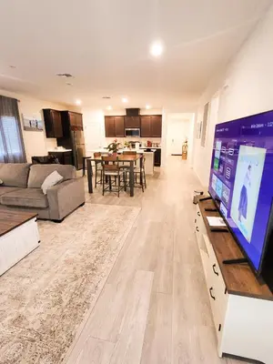 a living room with a large flat screen tv at Vip Class Two in Lodi
