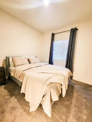 a bedroom with a large bed with a window at Vip Class Two in Lodi