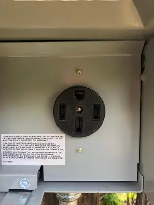 a machine with a sign on the side of it at Cozy Riverfront Home with EV charger in Three Rivers