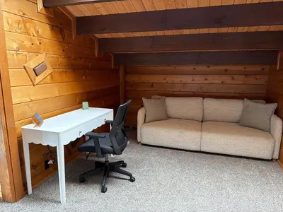 a room with a desk and a couch and a table at Three Bears Getaway Tahoe in Kings Beach