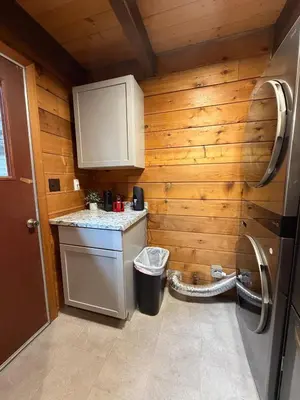 a small kitchen with a sink and a refrigerator at Three Bears Getaway Tahoe in Kings Beach