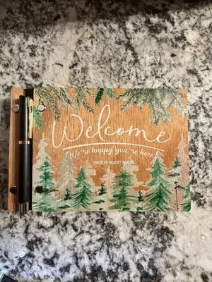 a welcome sign on a counter with trees on it at Three Bears Getaway Tahoe in Kings Beach