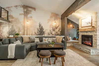a living room with a couch and a fireplace at Luxury Helios Retreat by the Village- Apres Ready in Mammoth Lakes