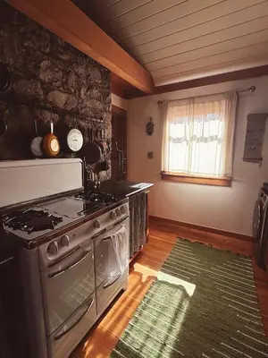 a kitchen with a stove and a kitchen rug at Campo Carnelian in Carnelian Bay
