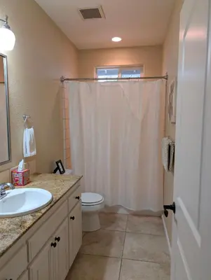 a bathroom with a sink and a toilet and a shower at Quiet Murphys getaway steps away from 25+ wineries in Murphys