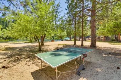 a ping pong table in a park with trees at Game Room and Hot Tub! Dog-Friendly Arnold Retreat in Arnold