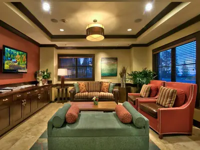 a living room with a couch and chairs and a table at Northstar Ritz-Carlton in Truckee