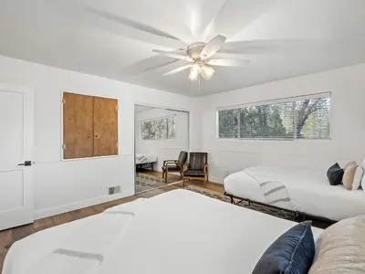 a bedroom with two beds and a ceiling fan at Forest Retreat that accommodates 29 people near Yosemite & Bass Lake in Oakhurst