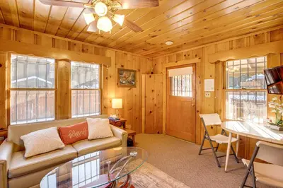 a living room with a couch and a table at Close to Lake and Heavenly Mtn Resort! Quaint Cabin in South Lake Tahoe