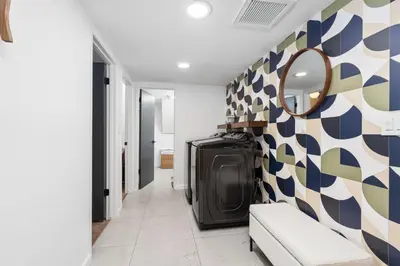 a hallway with a mirror on a wall at New! Stunning views Hot tub King beds in Oakhurst