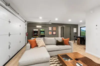 a living room with a couch and a table at New! Stunning views Hot tub King beds in Oakhurst