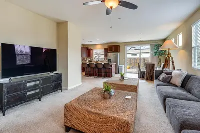 a living room with a couch and a tv at Sophisticated Sanctuary 8 Mi to Lodi Wineries! in Stockton