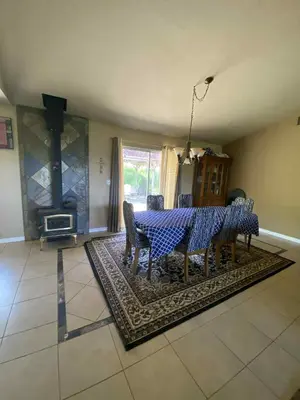 a dining room with a table and chairs and a fireplace at St Annas House in Squaw Valley
